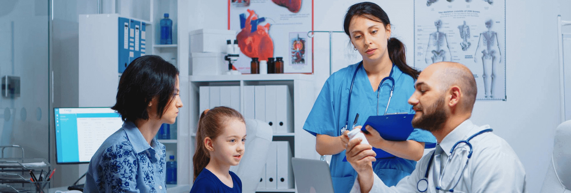 Children`s Doctor Working with Little Patient in Clinic